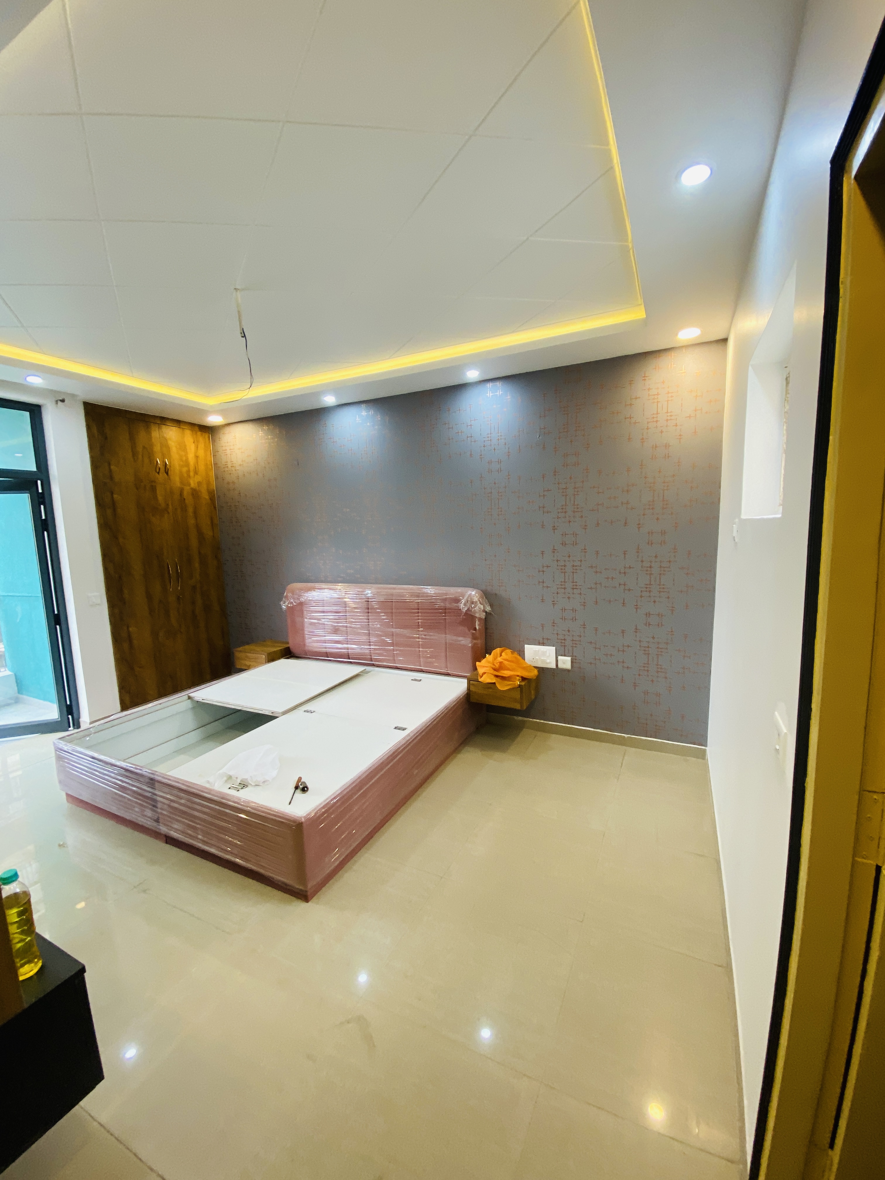 Modern bedroom TV wall and storage installation